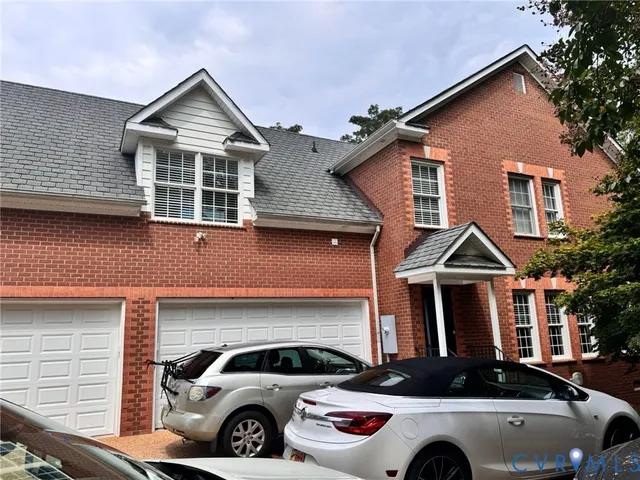 a front view of a house with parking space