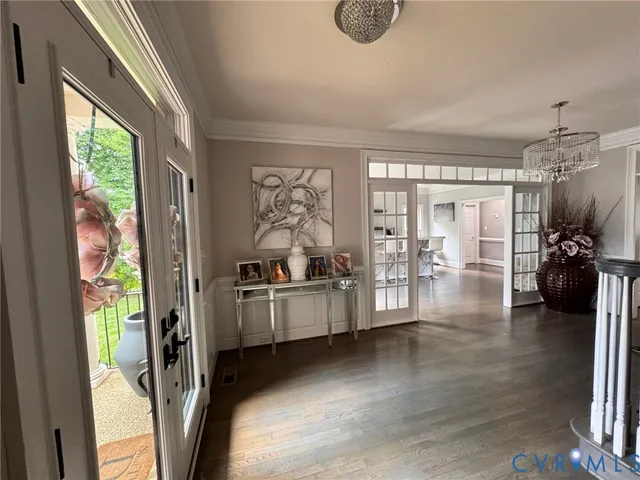 a view of a living room and hardwood floor