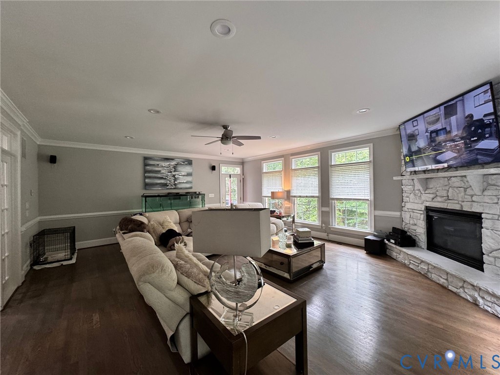 3231 Queens Grant Drive Midlothian, VA 23113 - Photo 8 of 48 a living room with furniture a fireplace and a floor to ceiling window