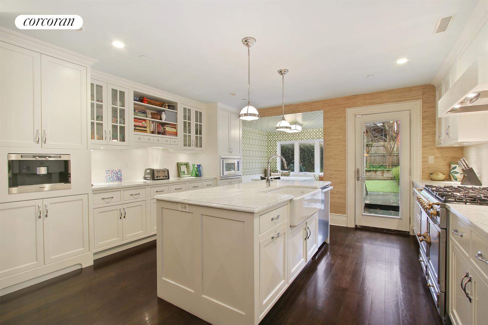 258 11th Street Brooklyn, NY 11215 - Photo 1 of 1 a large kitchen with kitchen island granite countertop lots of counter top space and stainless steel appliances