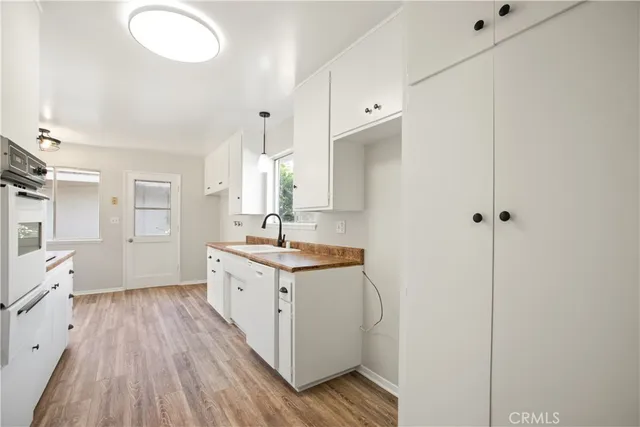 a spacious bathroom with a double vanity sink and mirror