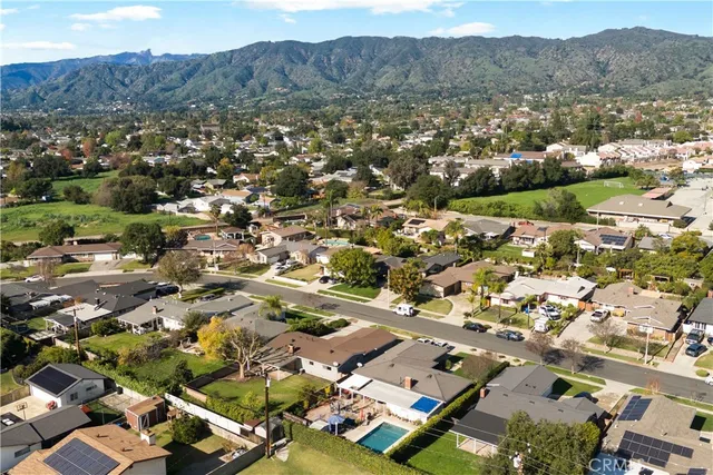 an aerial view of residential houses and street