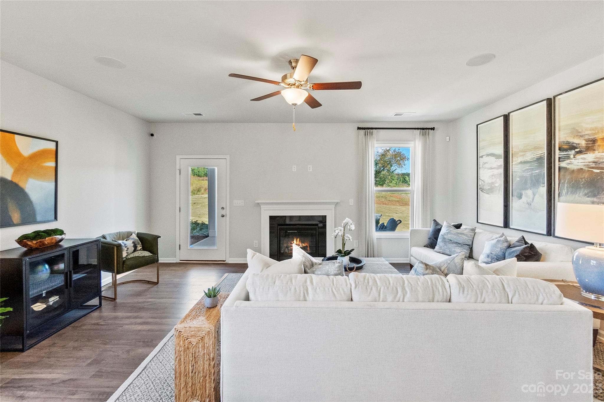 3107 Laurel Brook Drive Denver, NC 28037 - Photo 12 of 31 a living room with furniture fireplace and a flat screen tv