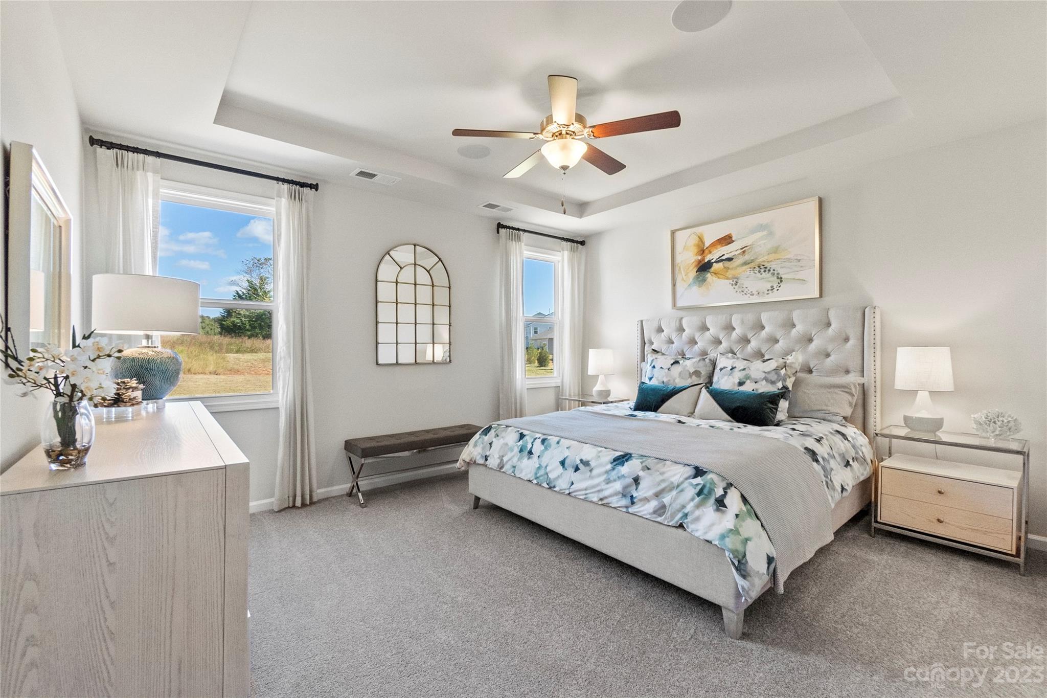 3107 Laurel Brook Drive Denver, NC 28037 - Photo 14 of 31 a bedroom with a large bed a chandelier and dresser