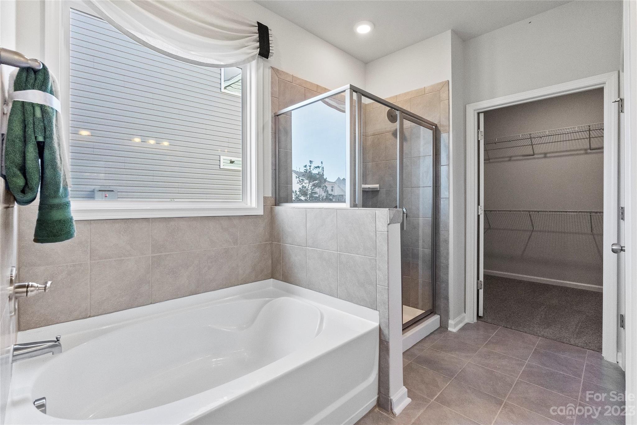 3107 Laurel Brook Drive Denver, NC 28037 - Photo 17 of 31 a bathroom with a bathtub and a shower