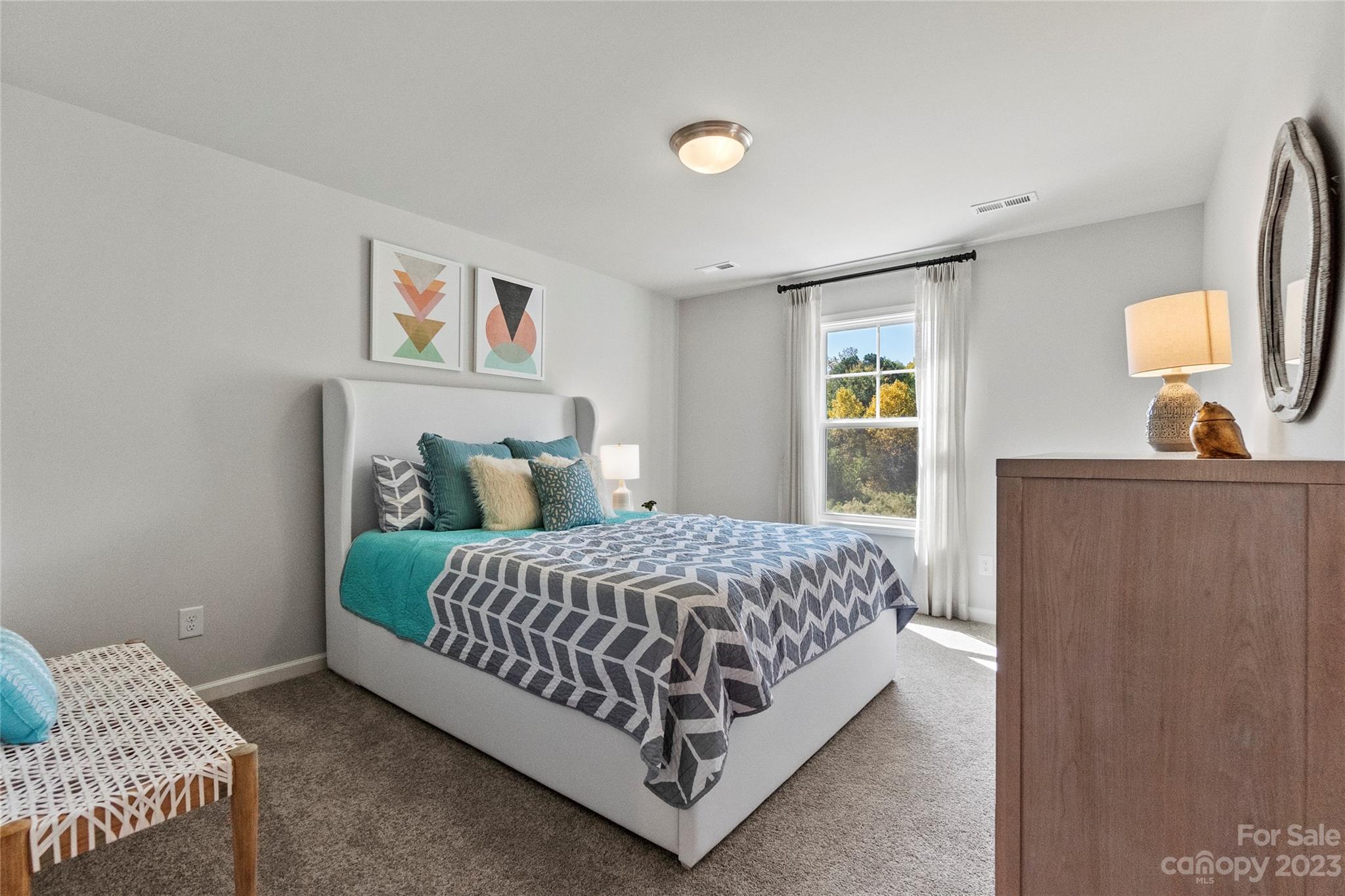 3107 Laurel Brook Drive Denver, NC 28037 - Photo 21 of 31 a bedroom with a bed and painting on the wall