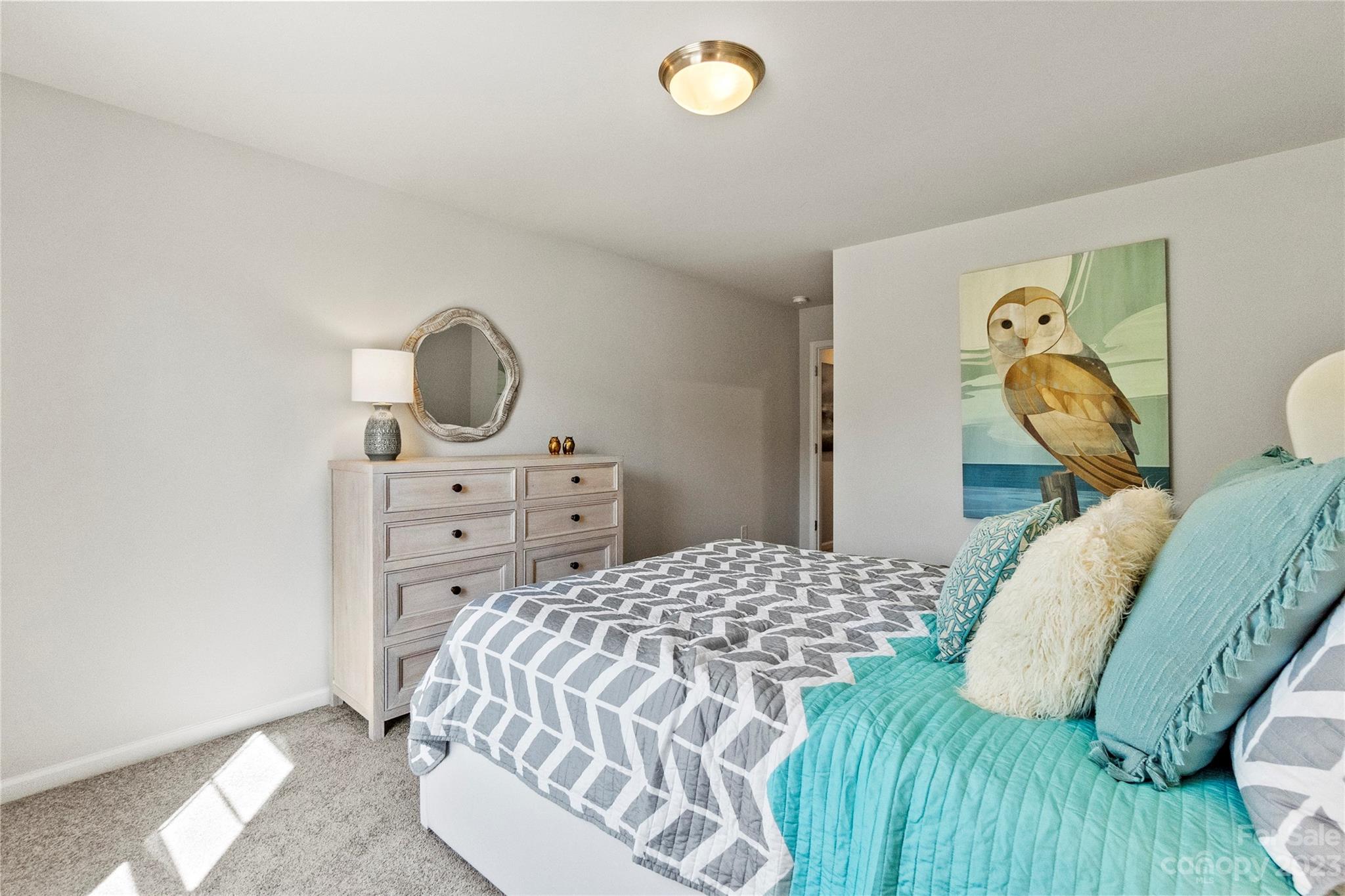 3107 Laurel Brook Drive Denver, NC 28037 - Photo 22 of 31 a bedroom with a bed and painting on the wall