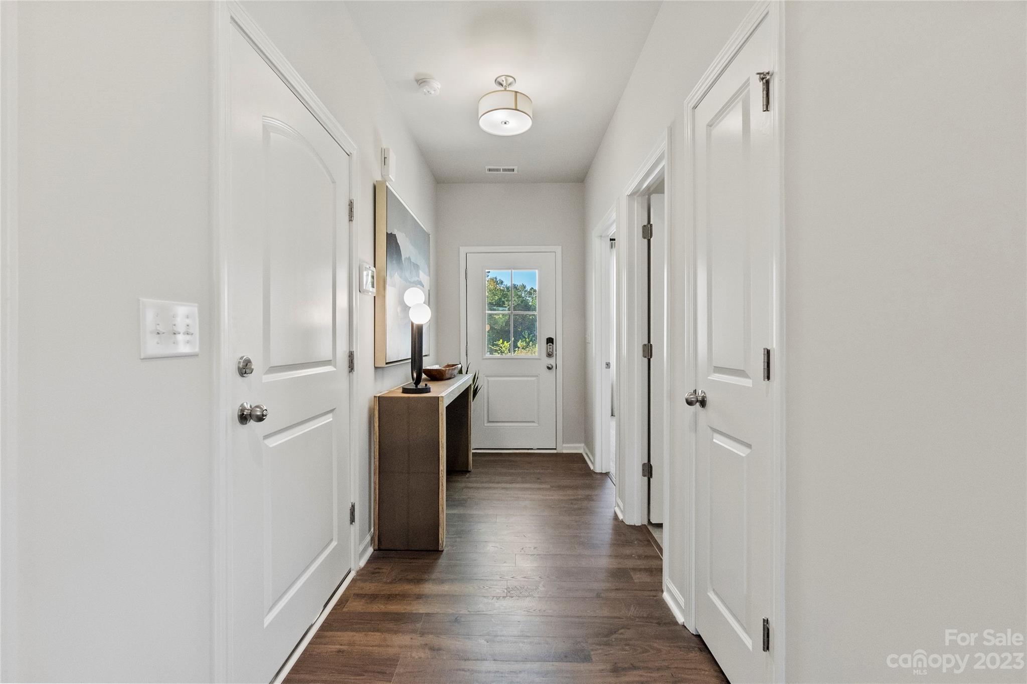 3107 Laurel Brook Drive Denver, NC 28037 - Photo 3 of 31 a view of a hallway with wooden floor and staircase
