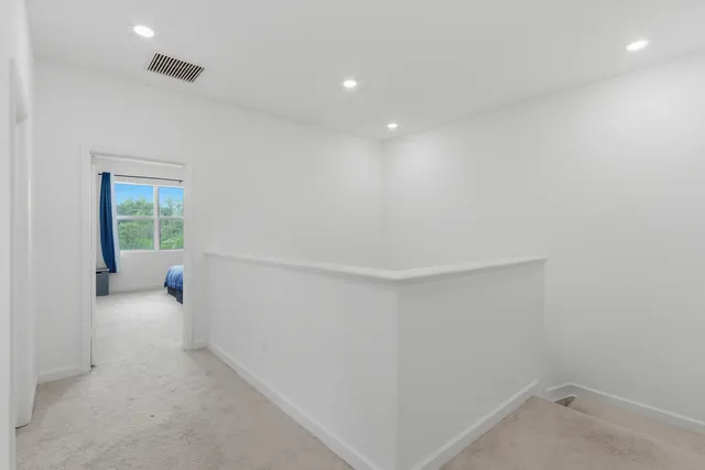 a view of a room with air conditioner and a window