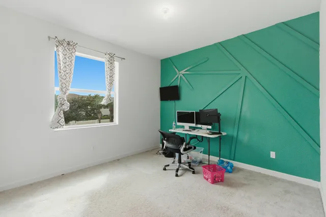 a workspace with furniture and a window