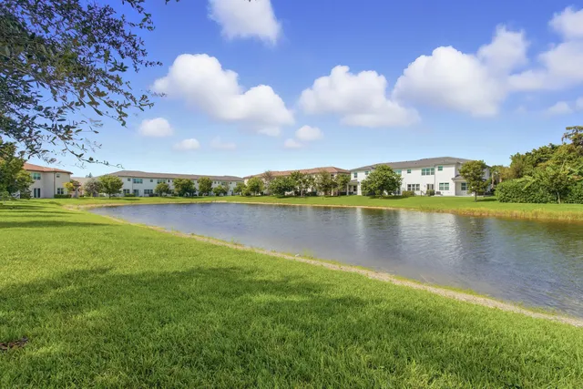 a view of a lake with houses in the back