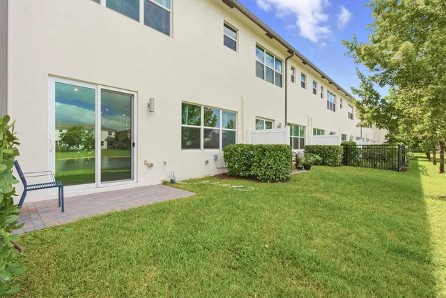 a view of backyard with a garden and plants