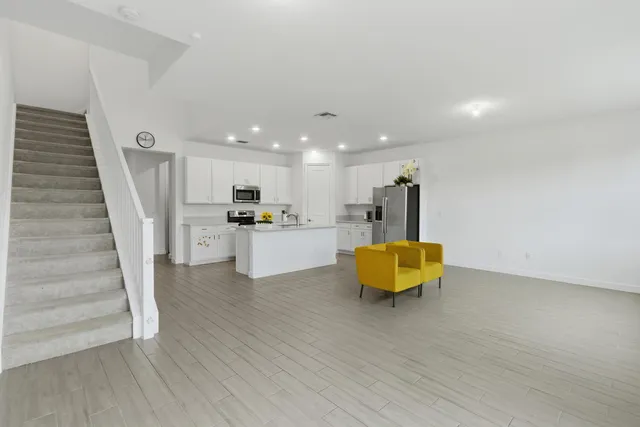 a view of kitchen with cabinets and wooden floor