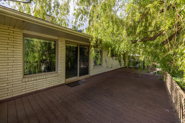 1365 Sumac Drive Logan, UT 84321 - Photo 60 of 66 Expansive wood deck with a metal railing