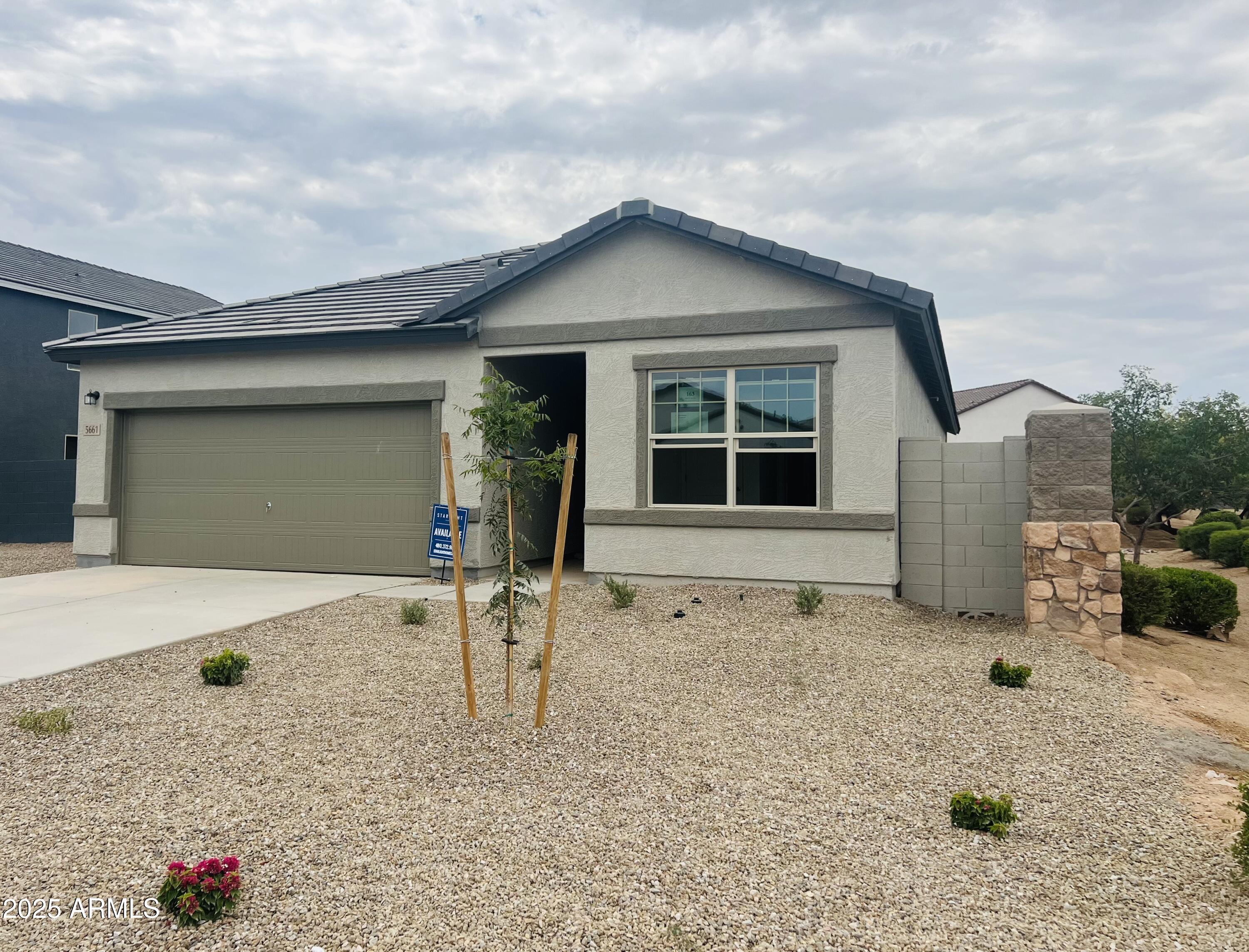 5661 East Iris Drive Florence, AZ 85132 - Photo 2 of 14 a house with a outdoor space