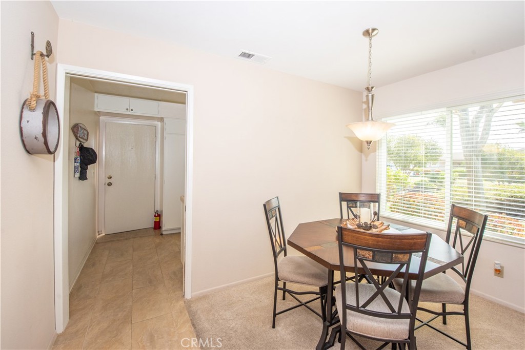 4433 Albatross Way Oceanside, CA 92057 - Photo 15 of 47 a view of a dining room with furniture window and outside view