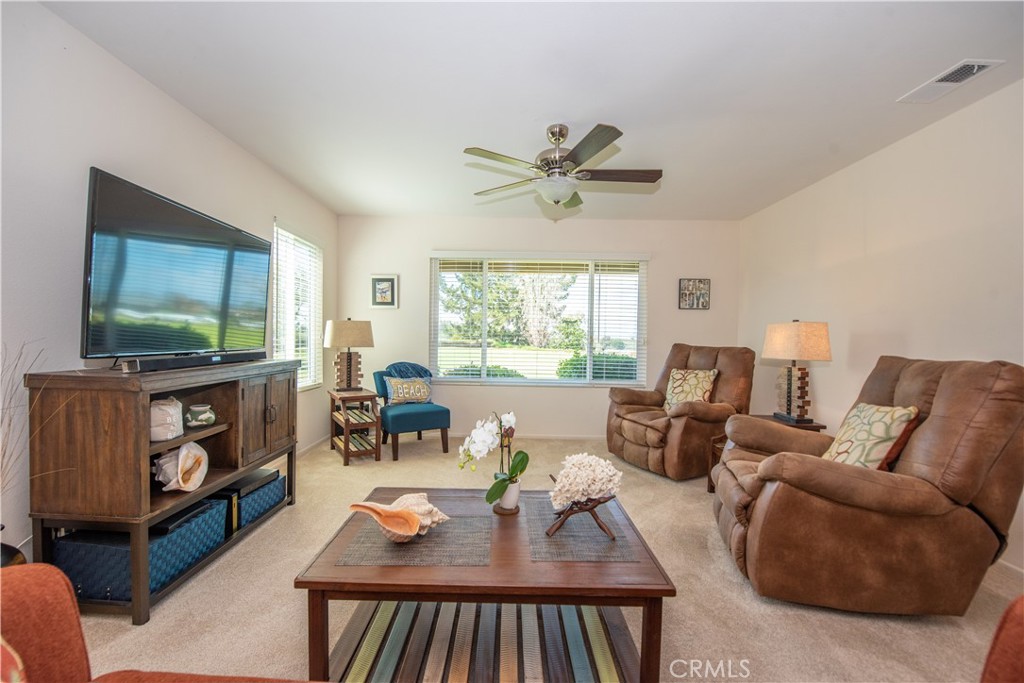 4433 Albatross Way Oceanside, CA 92057 - Photo 18 of 47 a living room with furniture and a flat screen tv