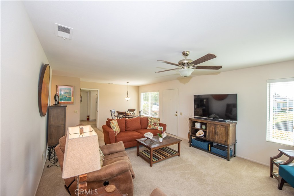 4433 Albatross Way Oceanside, CA 92057 - Photo 20 of 47 a living room with furniture and a flat screen tv