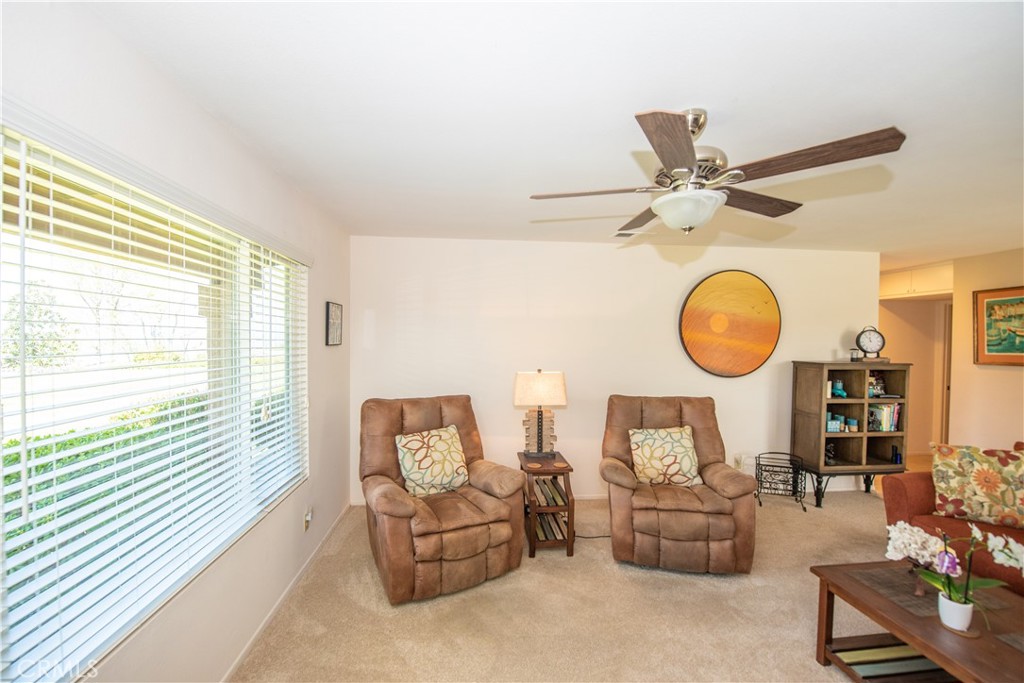 4433 Albatross Way Oceanside, CA 92057 - Photo 21 of 47 a living room with furniture and a large window