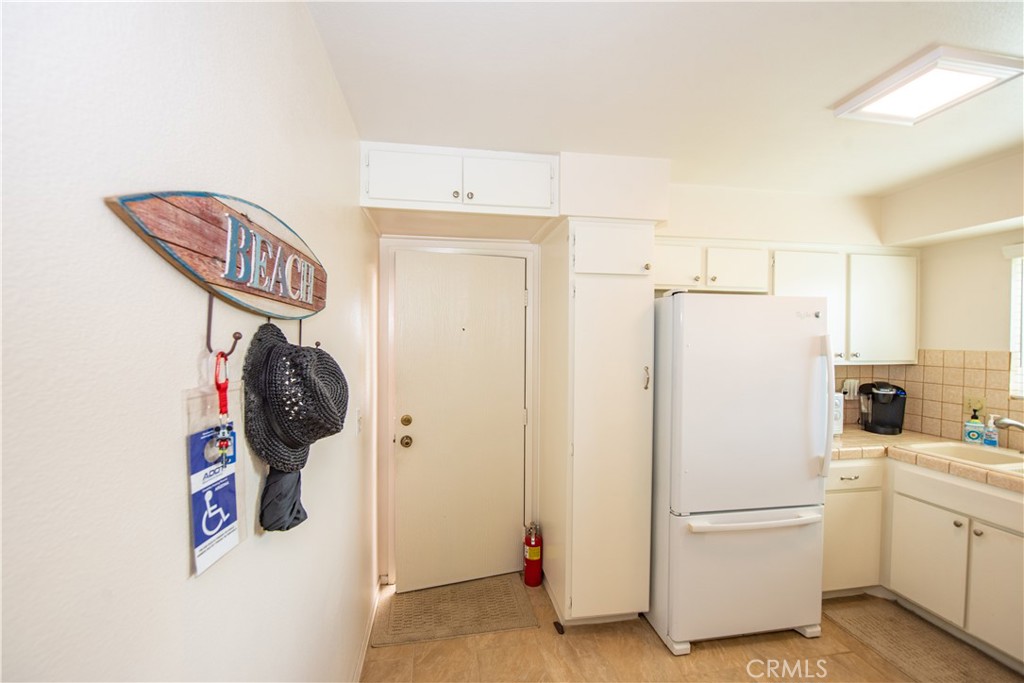 4433 Albatross Way Oceanside, CA 92057 - Photo 24 of 47 a white refrigerator freezer sitting in a kitchen