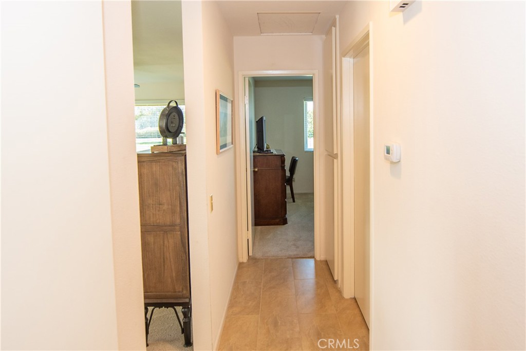 4433 Albatross Way Oceanside, CA 92057 - Photo 25 of 47 a view of a bedroom from a hallway