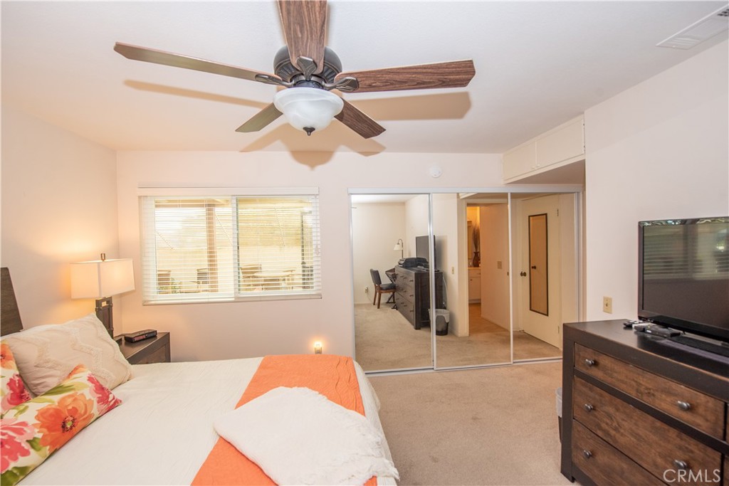 4433 Albatross Way Oceanside, CA 92057 - Photo 26 of 47 a bedroom with furniture and a flat screen tv