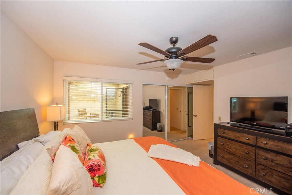 4433 Albatross Way Oceanside, CA 92057 - Photo 28 of 47 a bedroom with a bed and a flat screen tv