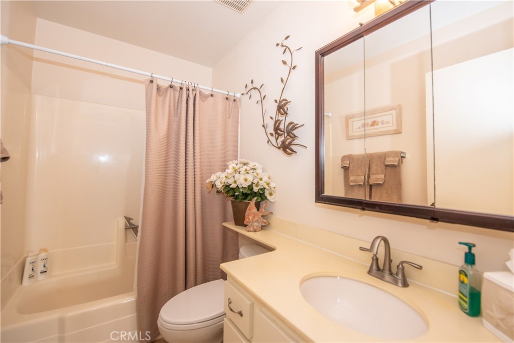 4433 Albatross Way Oceanside, CA 92057 - Photo 32 of 47 a bathroom with a sink a toilet and shower