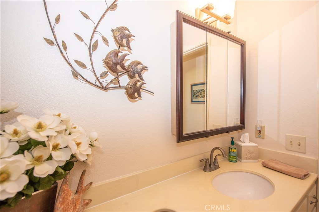 4433 Albatross Way Oceanside, CA 92057 - Photo 34 of 47 a bathroom with a sink vanity and a mirror