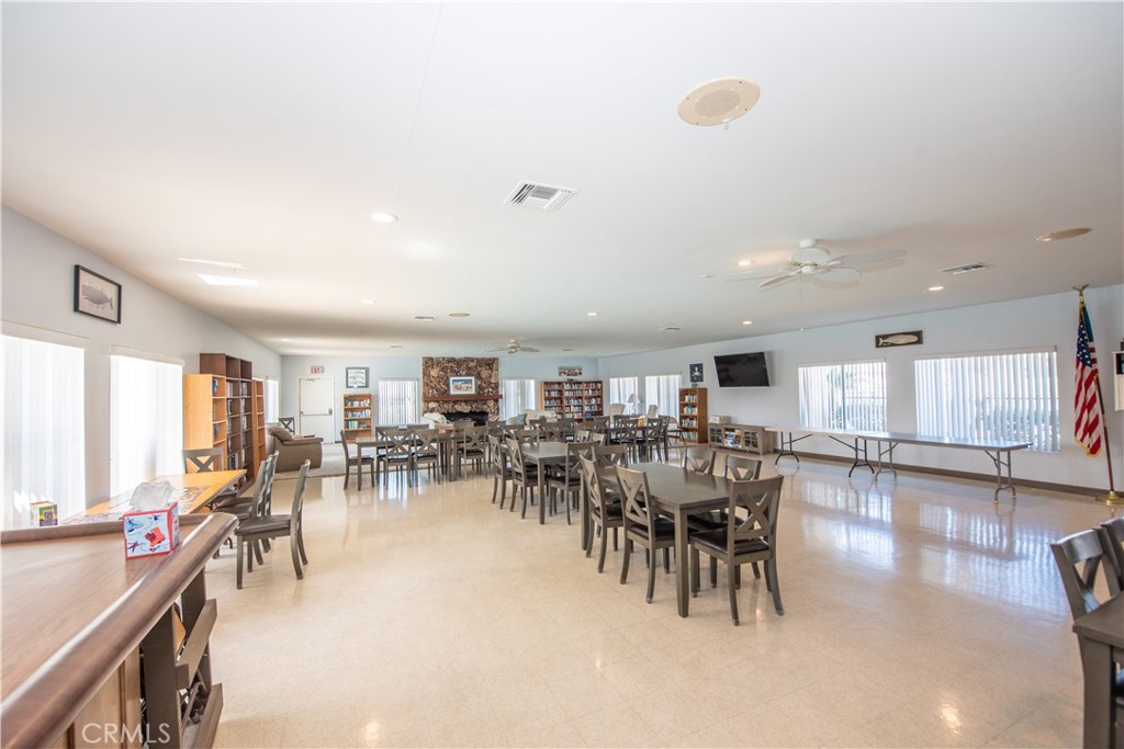 4433 Albatross Way Oceanside, CA 92057 - Photo 45 of 47 a view of a dining area with furniture and chandelier