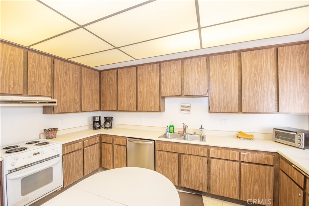 4433 Albatross Way Oceanside, CA 92057 - Photo 47 of 47 a kitchen with stainless steel appliances granite countertop a sink a stove and cabinets