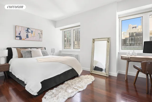 a bedroom with double bed and a window