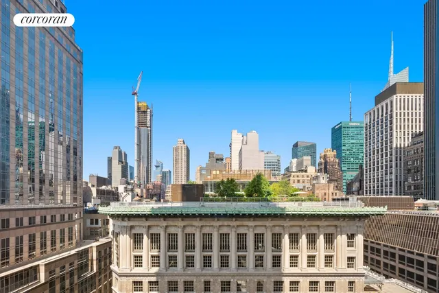 a view of city with tall buildings