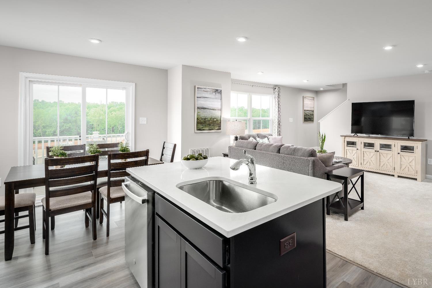130 Robinia Road Lynchburg, VA 24501 - Photo 3 of 14 a view of kitchen with sink dining table and chairs
