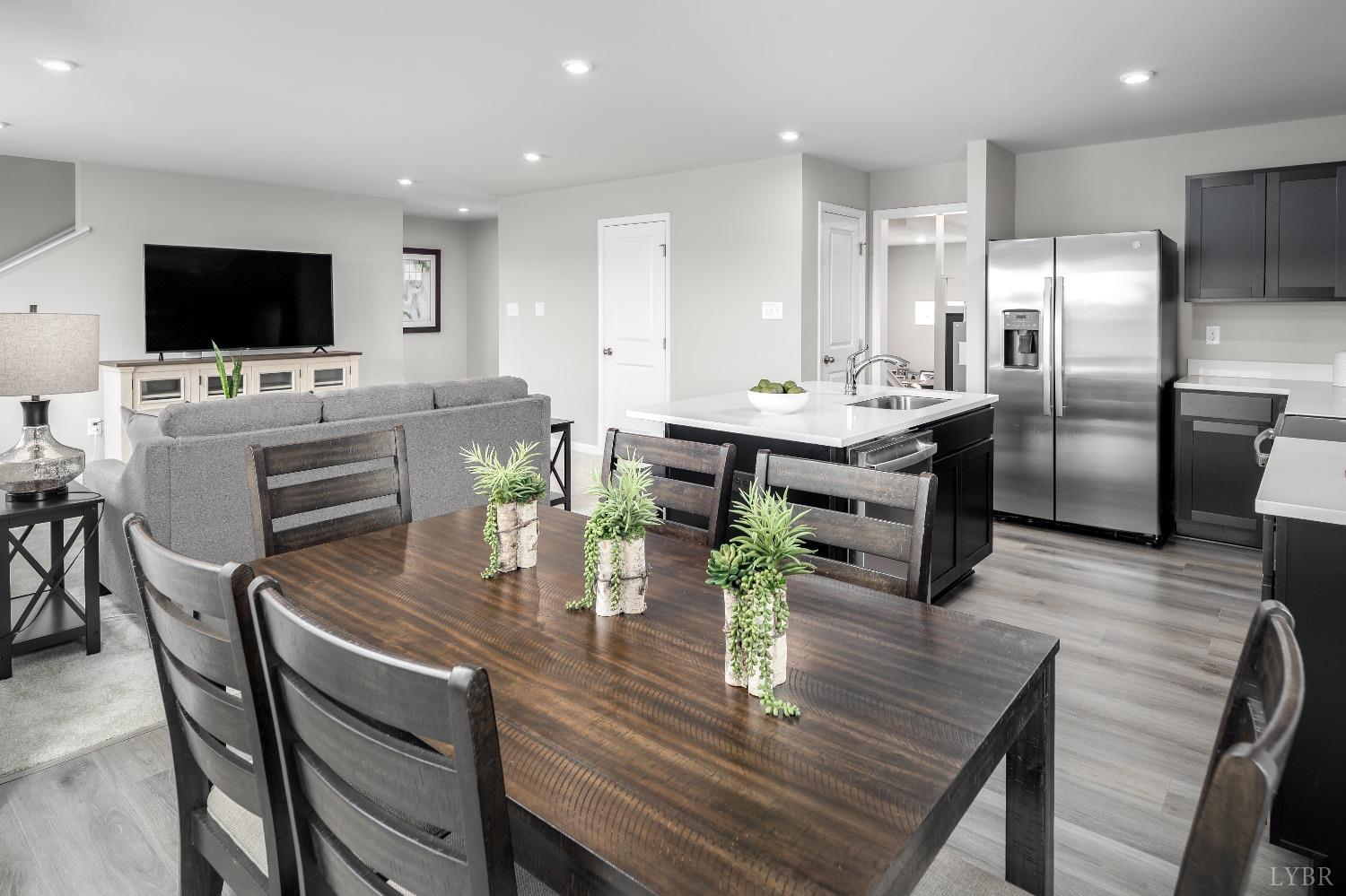 130 Robinia Road Lynchburg, VA 24501 - Photo 4 of 14 a living room with furniture kitchen view and a flat screen tv