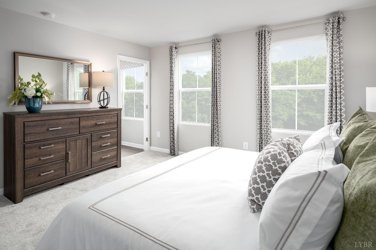 130 Robinia Road Lynchburg, VA 24501 - Photo 8 of 14 a bedroom with a bed and a dresser