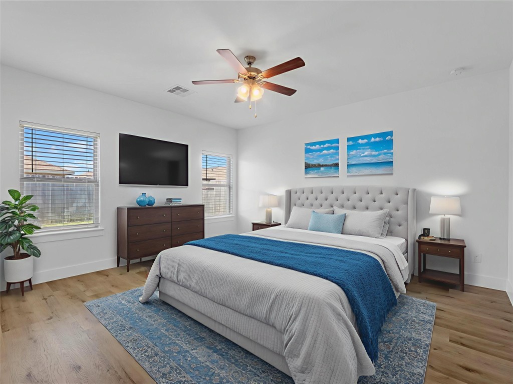 24751 Russet Bluff Trail Houston, TX 77336 - Photo 14 of 26 a bedroom with a bed and a flat screen tv