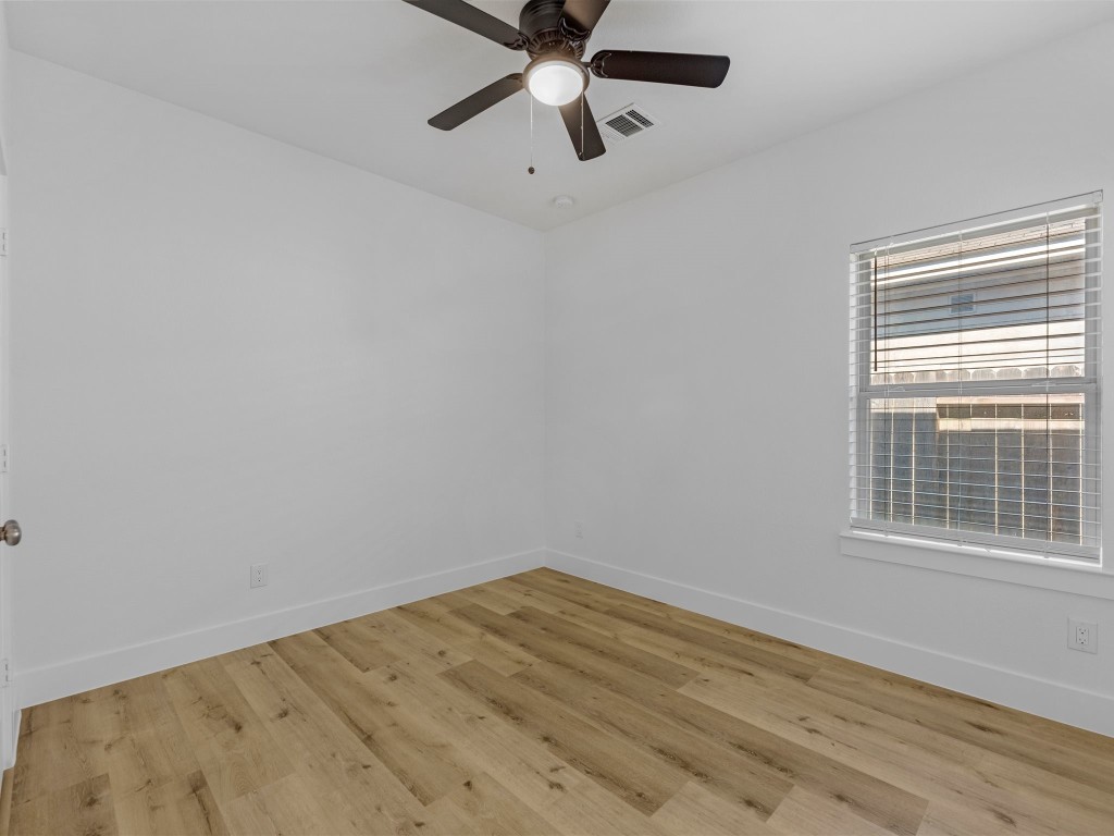 24751 Russet Bluff Trail Houston, TX 77336 - Photo 19 of 26 a view of empty room with wooden floor and fan