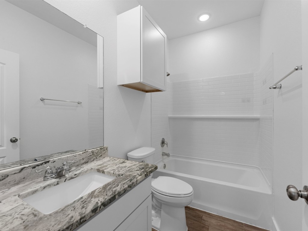 24751 Russet Bluff Trail Houston, TX 77336 - Photo 20 of 26 a bathroom with a sink a toilet and shower