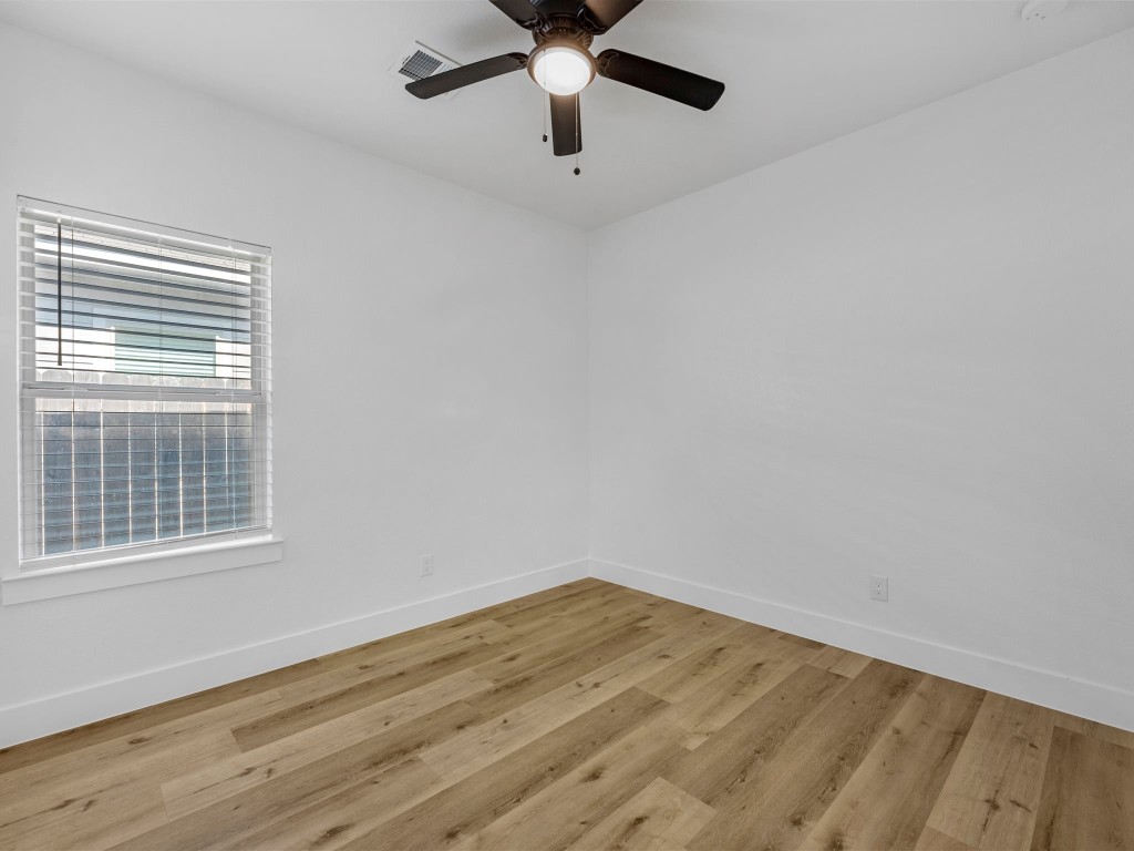 24751 Russet Bluff Trail Houston, TX 77336 - Photo 22 of 26 a view of empty room with wooden floor