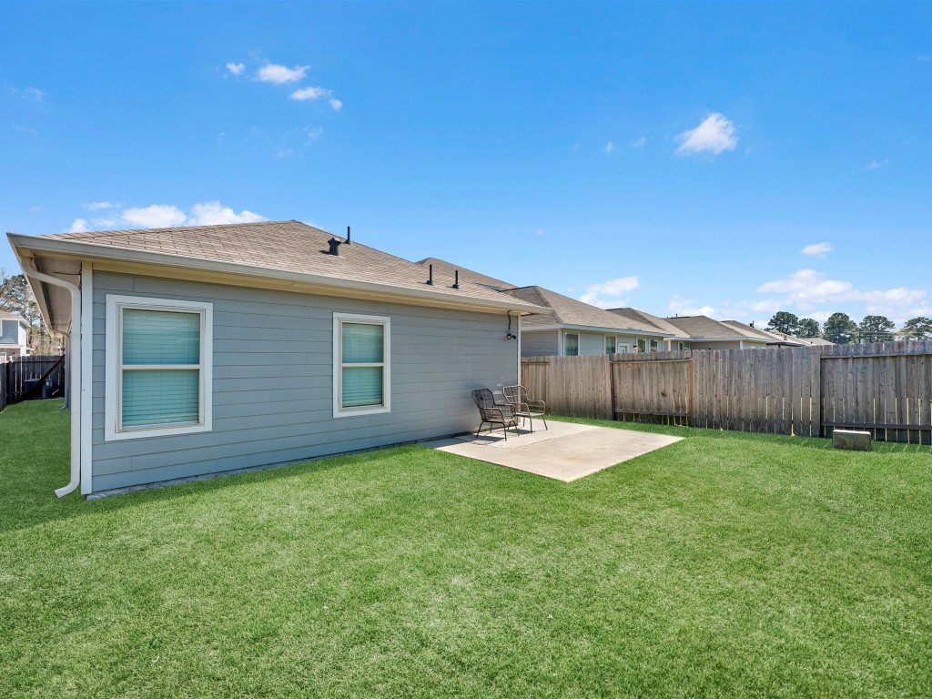 24751 Russet Bluff Trail Houston, TX 77336 - Photo 26 of 26 a view of a house with a yard and wooden fence