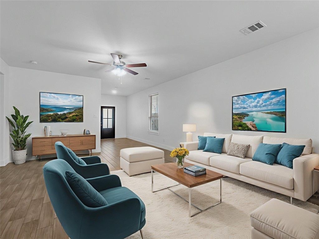 24751 Russet Bluff Trail Houston, TX 77336 - Photo 3 of 26 a living room with furniture ceiling fan and a rug