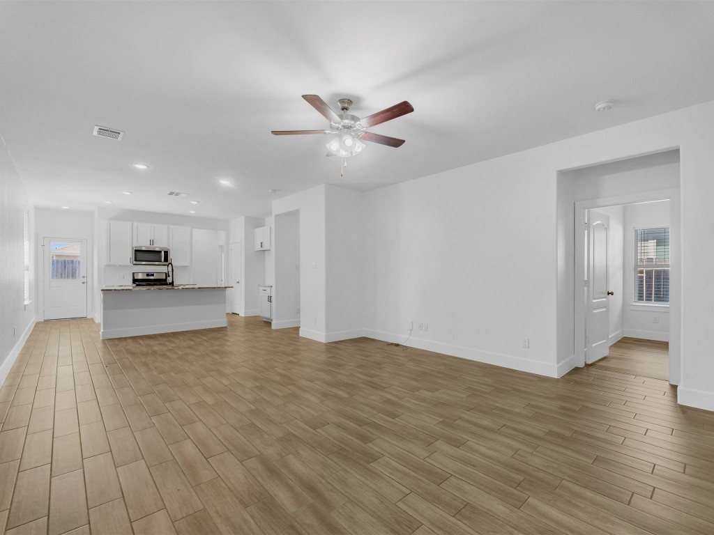 24751 Russet Bluff Trail Houston, TX 77336 - Photo 6 of 26 a view of kitchen and hall with wooden floor