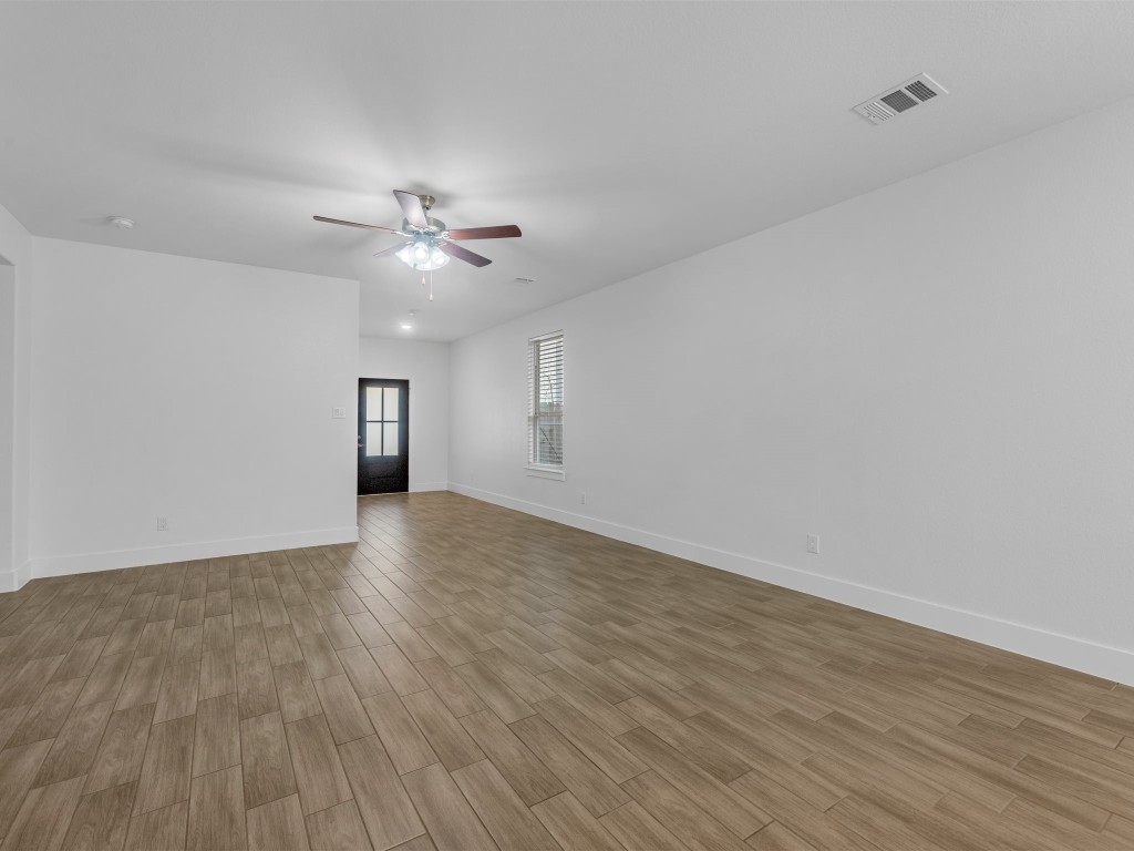 24751 Russet Bluff Trail Houston, TX 77336 - Photo 8 of 26 a view of an empty room with wooden floor