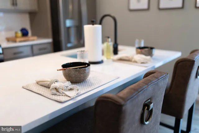 a kitchen with a sink and a refrigerator