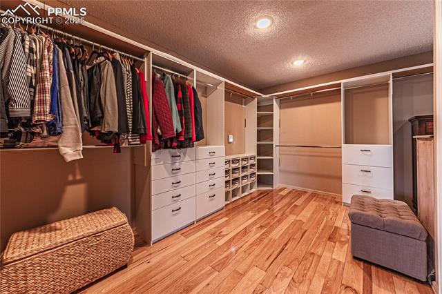 7175 Higher Ridges Court Colorado Springs, CO 80919 - Photo 25 of 50 Walk in closet with wood finished floors