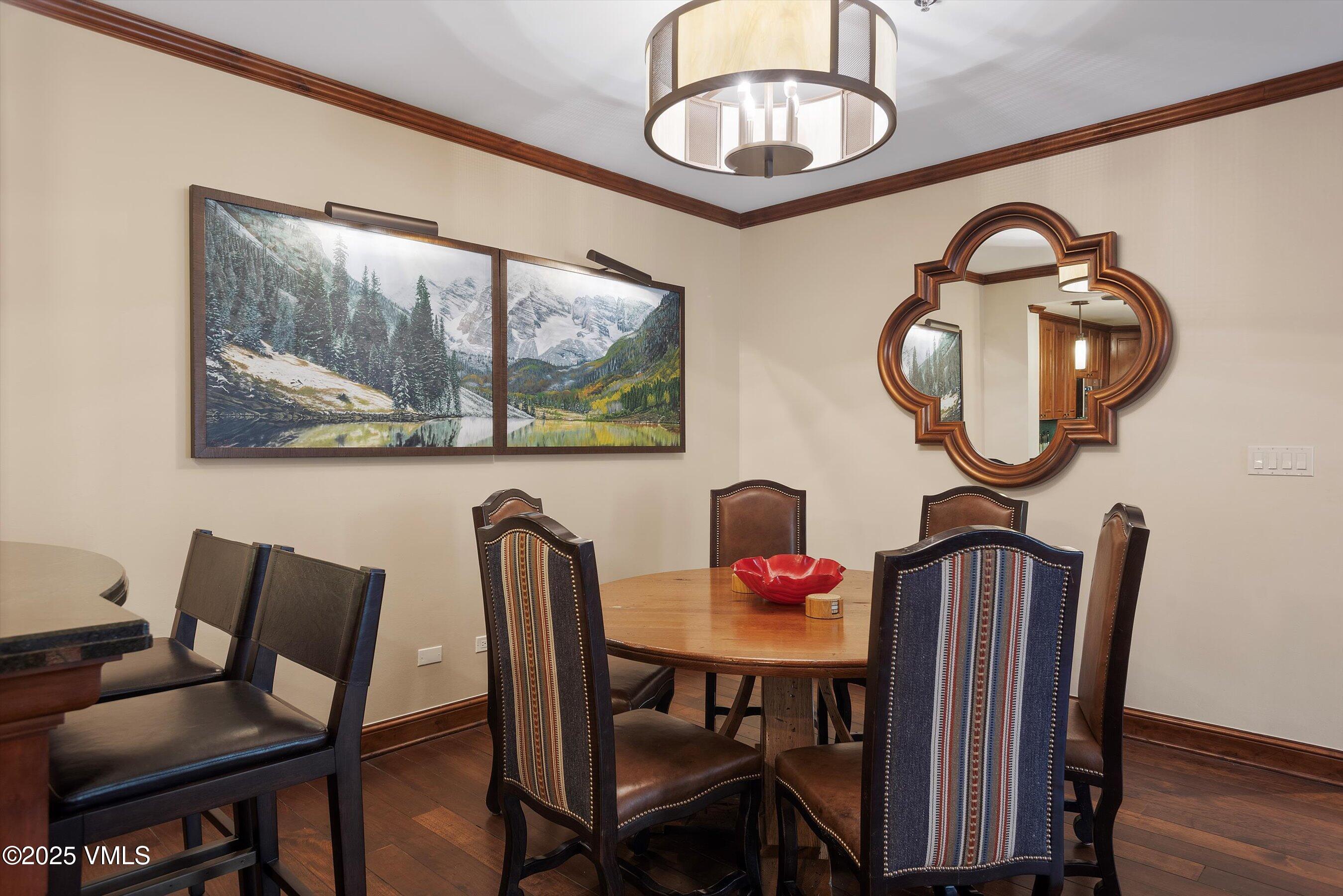 39 Boomerang Road, Unit 841114 Aspen, CO 81611 - Photo 13 of 35 a view of a dining room with furniture and wooden floor