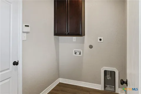 a view of a bathroom with wooden floor