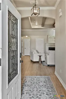 a living room with furniture and a rug