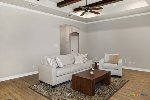 a living room with furniture and a rug